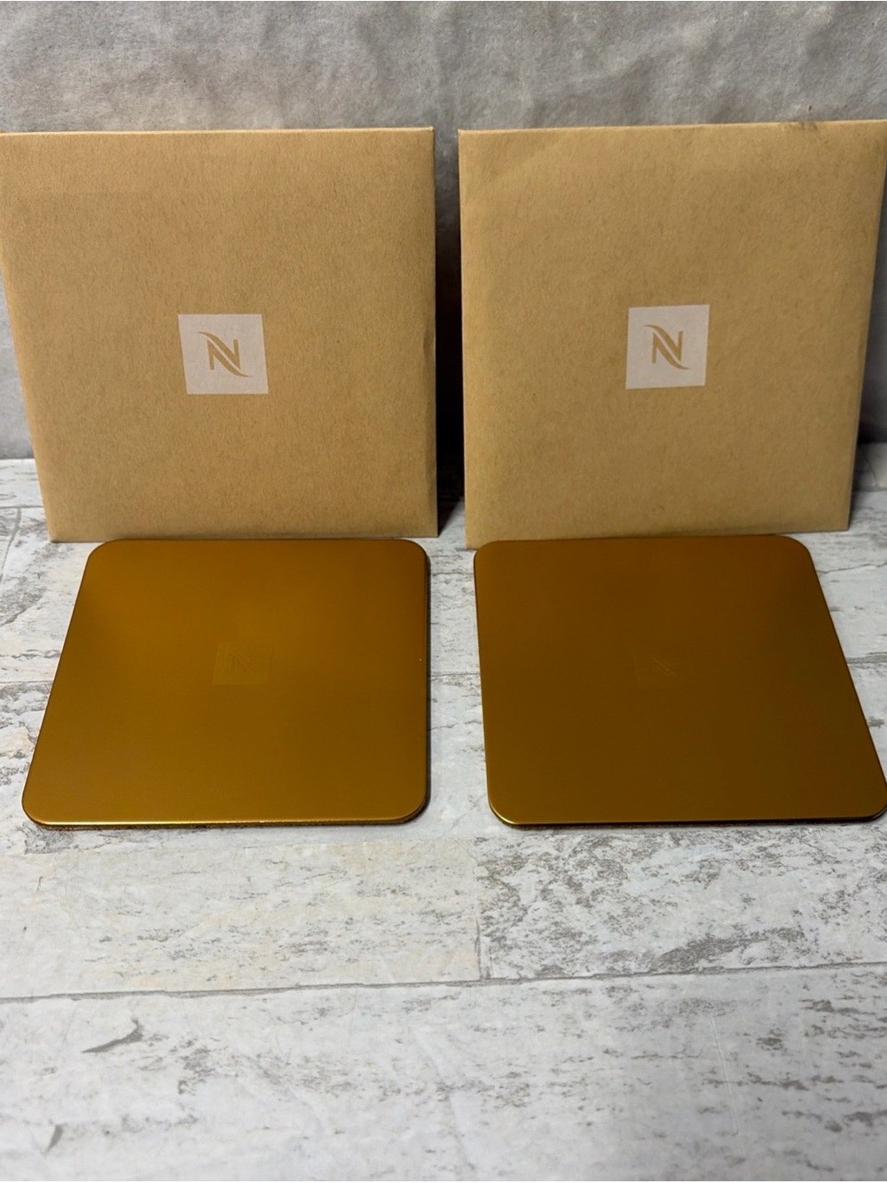 NEW Nespresso Set of 2 Bronze Gold Coasters 25% Recycled Aluminum Cork Backed